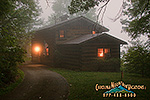 The warm glow of grandpa's cabin through the early morning mist.