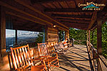 Recline in a rocking chair and watch nature surround you on the large covered deck